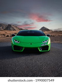 DUBAI, UAE - 01 01 2021: Lamborghini ~Huracan, luxury car in dubai desert at sunset, mountains, Supercar 
