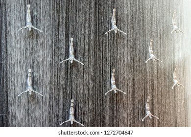 Dubai / UAE - 03.11.2018 : Diver Figure Waterfall In Dubai Mall With Sunlight