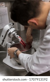 Dubai / UAE - 04 22 2017: Chef Prepares Food In Commercial Kitchen, Using Kitchen Aid