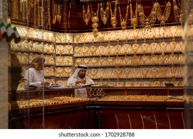 DUBAI, UAE 06 01 2015: A sales man in Dubai Gold Souk. There is gold everywhere.