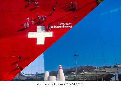 Dubai, UAE - 06 Dec 2021: Switzerland Pavilion Exterior: Glass Mirror Building With Swiss Flag And Sign, Dubai Expo 2020 Abstract Detail