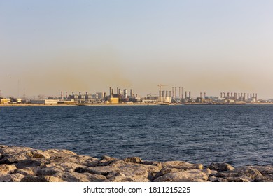 Dubai, UAE, 06/09/20. DEWA Jebel Ali Power Plant And Desalination Complex, With Chimneys Smoking Into The Air.