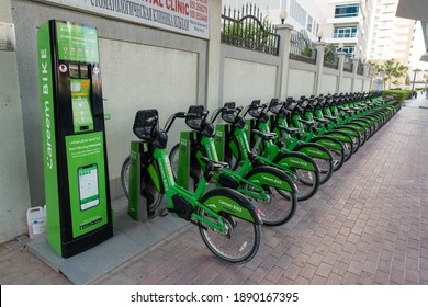 Dubai, UAE – 10 14 2020: View to parking lot with green bicycles, Careem BIKE sharing initiative was launched with support of Roads and Transport Authority RTA.