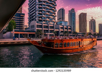 Dubai, UAE / 11. 10. 2018 : Sunset On The Famous Traditional Wooden Old Dhow Cruise Tour In Dubai Marina