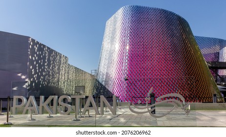 Dubai, UAE, 15.11.2021. Pakistan Pavilion At Expo 2020 Dubai, Colorful Shiny Glass Modern Building With Glass Tiles Facade, PAKISTAN Sign In Front. 