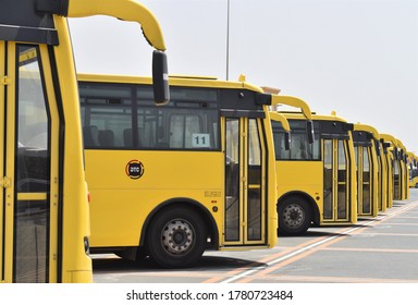 Dubai, UAE - 21 July 2020: Selective Focus On The First Bus Of A Row Of Parked Yellow School Buses, Out Of Use Due To Schools Closed Due To The Covid Pandemic