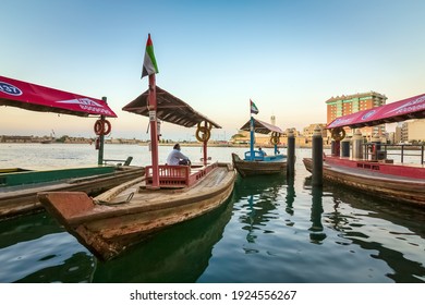 Dubai, UAE, 26 January 2021: View of Dubai Creek. Boats and Abra ferries on the Bay of Creek in Dubai. Famous tourist destination in the UAE.
