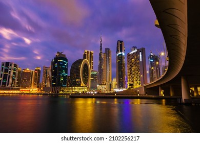 Dubai, UAE, 5 January 2022: Beautiful View Of Dubai City Skyscrapers Or Towers Along With Burj Khalifa At Night. Long Exposure Shot.