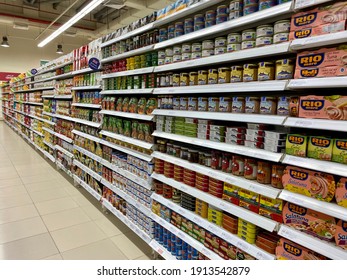 Dubai, UAE - 9 February 2021: A Fully Stocked Aisle In A Supermarket With No People, Featuring Canned Goods And Seafood