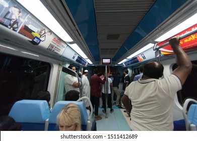 Dubai, UAE - 9 May 2013: Inside Dubai Metro Train During Rush Hour