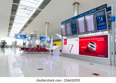 DUBAI, UAE - APRIL 18, 2014: airport interior. Dubai International Airport is an international airport serving Dubai. It is a major airline hub in the Middle East, and is the main airport of Dubai.