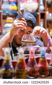 Dubai, Dubai /UAE -April 19 2019 
Beautiful Image Of Arab Man Drawing Sand In Bottle. Man Making Amazing Art In Dubai, United Arab Emirates.