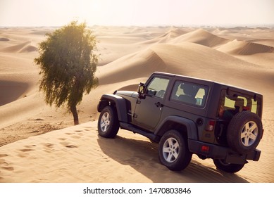 Dubai, UAE - APRIL 23, 2017: Jeep Wrangler Offroad Adventure Dune Bashing In The Desert Of Dubai Near An Oasis Reserve
