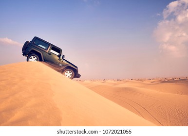 Dubai, UAE - APRIL 24, 2017: Jeep Wrangler Offroad Adventure In The Red Desert Of Dubai On The Sand Dune