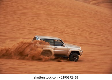 Dubai, UAE - APRIL 24, 2018: Up hill climbing battle off road on the big red dune in the Dubai desert