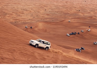 Dubai, UAE - APRIL 24, 2018: Up hill climbing battle off road on the big red dune in the Dubai desert