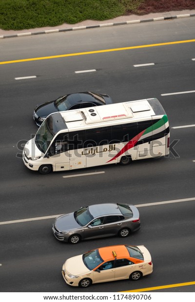 DUBAI, UAE - AUGUST, 2018: Emirates Airlines employees\
bus on the highway. 