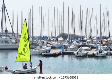 Dubai, UAE - Circa June 2019: Children Prepare To Sail A Training Sailboat With An Instructor During Sailing Lessons At The Dubai Offshore Sailing Club