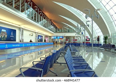 DUBAI, UAE - CIRCA NOVEMBER, 2009: Dubai International Airport DXB Departure Hall Interior View With Information Billboard Floor Reflections Attractive Lightning Detail Panoramic Wide