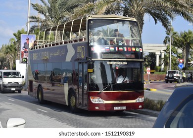 Dubai, UAE - December 20 2018: The state of the art open-top buses operate from Deira to Atlantis, stopping at major landmarks including the Burj Khalifa, Sheikh Zayed Road, Madinat Jumeirah