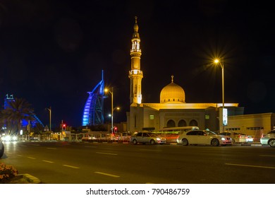 Dubai, UAE - December 31, 2017: Burj Al Arab Hotel, Jumeirah Hotel And Mosque On Jumeirah  Street At Night