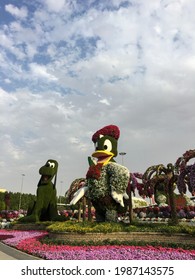 Dubai, UAE - February 11, 2020: Low Angle View Of Huge Louie Duck Statue Made Of Green Grass In Dubai Miracle Garden.