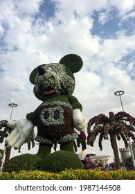 Dubai, UAE - February 11, 2020: Low Angle View Of Huge Mickey Mouse Statue Made Of Green Grass In Dubai Miracle Garden.