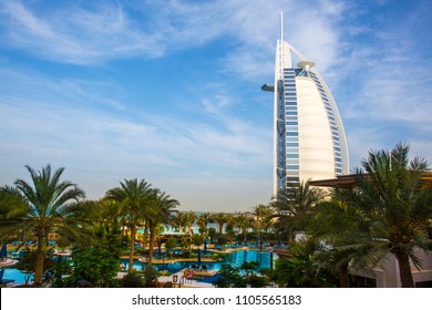 DUBAI, UAE - FEBRUARY 14, 2018: View at Burj Al arab hotel from Madinat Jumeirah luxury hotel in a sunny summer day in Dubai. Beautiful paradise resort United Arab Emirates