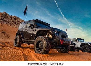 Dubai, UAE - February 2, 2018: Jeep Wrangler Off Road Adventure In The Red Desert Of Dubai On The Sand Dune.