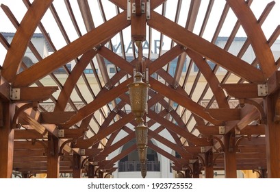 Dubai, UAE - February 20, 2021 - Wooden roof structure with bronze street lights. Dubai mall. the world's largest shopping center