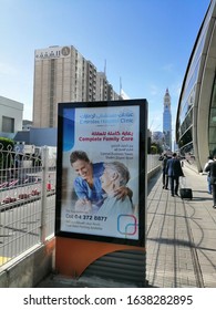 Dubai, UAE - February 7, 2020: An Outdoor Advertising Panel/mupi On A Pavement Next To Dubai World Trade Centre Metro Station Displays An Advertising Poster.