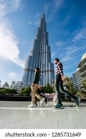 Dubai, UAE - January 14, 2019: An Amazing Worm's Eye View Portrait Image Of The Tallest Building In The World Burj Khalifa Tower On A Sunny Winter Day With People Walking And Shopping In Dubai Mall..