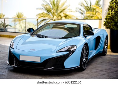 DUBAI, UAE - JANUARY 18, 2017: Blue Luxury Supercar McLaren On The Road In Dubai 