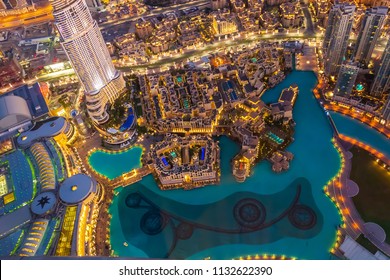 Dubai, UAE - January, 2015: Panoramic aerial view of Downtown Dubai and dancing fountain from Burj Khalifa. Top view. Night scene.