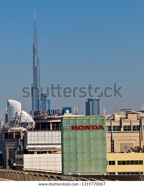 DUBAI, UAE - JANUARY 24, 2016: Honda Motors Middle\
East Company. Honda dealership sign. Honda Motor Co. Logo Located\
in Dubai.