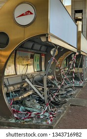 DUBAI, UAE - JANUARY 26, 2016: Broken Bus Station Steel Bench, Crash Glass Window Bus Stop Billboard On Stage, Here Are Air-conditioned Dubai, UAE