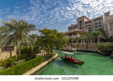 Dubai, UAE - January 28, 2017: View Of The Artificial Canal, Villas, Boat And Hotel Al Qasr Madinat Jumeirah.