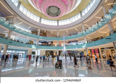 Dubai, UAE - July 19, 2018: People inside the Grand Atrium inside Dubai Mall