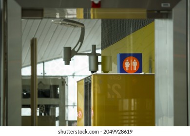 Dubai, UAE - Jun 2010: Interior of Dubai International Airport terminal with toilet sign at departure gate. No people.