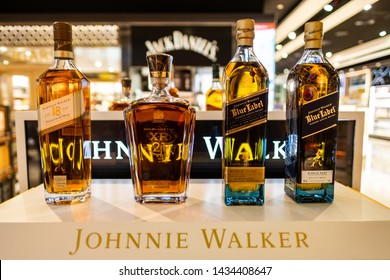 DUBAI, UAE- JUNE, 2019: Johnnie Walker whiskeys on display in duty free in Dubai airport