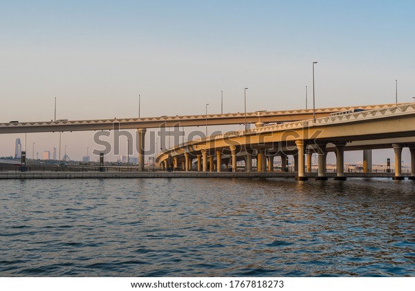 Dubai,\
UAE, June 29, 2020. Concrete car bridge over the water. Dubai water\
canal. Transportation in Dubai. Roads and forms.\
