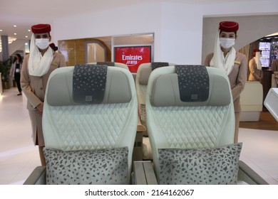 Dubai, UAE - June 5, 2022: Emirates Airline Female Cabin Crew Wearing Face Mask As A Protective Measure Against Covid-19 And Monkeypox Virus Threats.