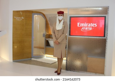 Dubai, UAE - June 5, 2022: Emirates Airline Female Cabin Crew Wearing Face Mask As A Protective Measure Against Covid-19 And Monkeypox Virus Threats.