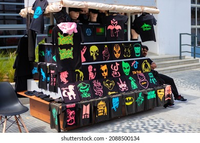 DUBAI, UAE - MARCH 15, 2021: Street stall with printed t-shirts at Dubai Marina