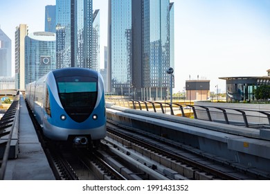 DUBAI, UAE - MARCH, 2020: Dubai Metro with skyscrapers at background