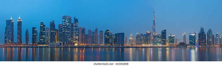 DUBAI, UAE - MARCH 23, 2017: The evening panorama over the new Canal with the Downtown and Burj Khalifa tower. - Shutterstock ID 615341858