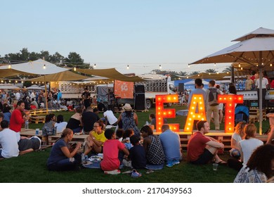 Dubai, UAE - March 26, 2016: Groups Of People Gathered For The Food Truck Jam, An Outdoor Event With Food Trucks And Live Music At The Emirates Golf Club.