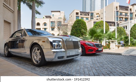 DUBAI, UAE - MARCH 30, 2014: Luxury car parked outside Palace Hotel. In Dubai there is a high concentration of luxury cars due to the high pro capital income. 