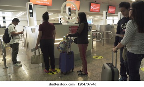 Dubai, UAE - March 30, 2018: Passengers in the zone of obtaining a visa at the Dubai International Airport
