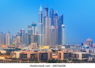 DUBAI, UAE - MARCH 31: Skyscrapers Of Dubai Marina At Night On March 31, 2014, UAE. Dubai Marina Is A District In Dubai With Artificial Canal City Who Accommodates More Than 120,000 People.